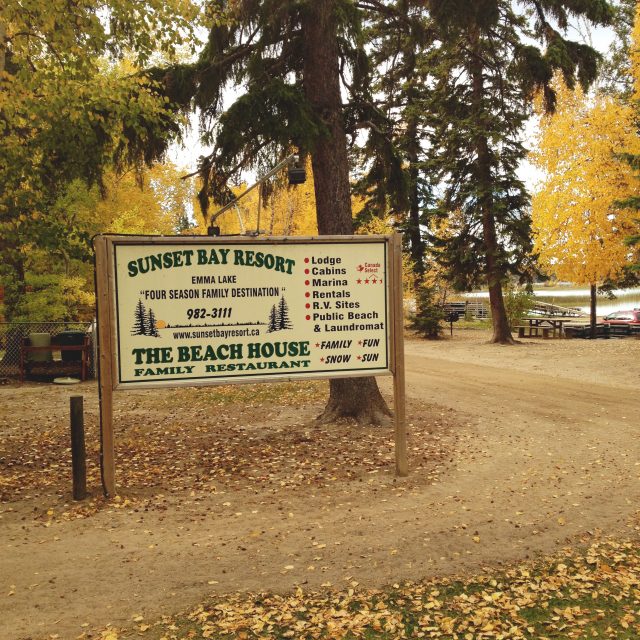 sunset bay sign in autumn surrounded by fall leaves